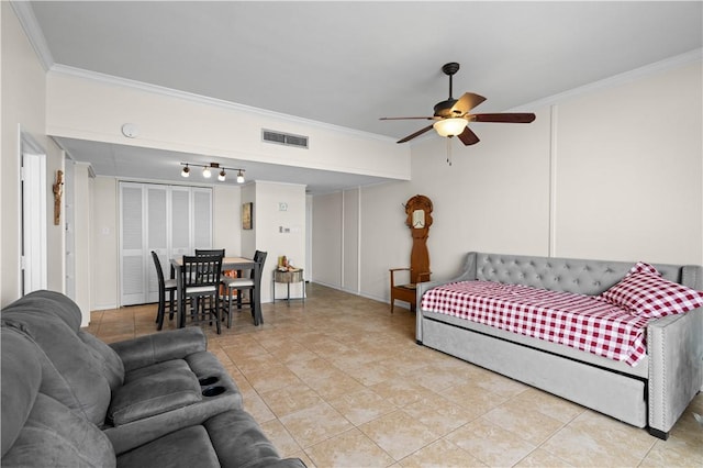 tiled living room with crown molding and ceiling fan