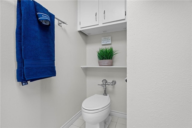 bathroom featuring tile patterned floors and toilet