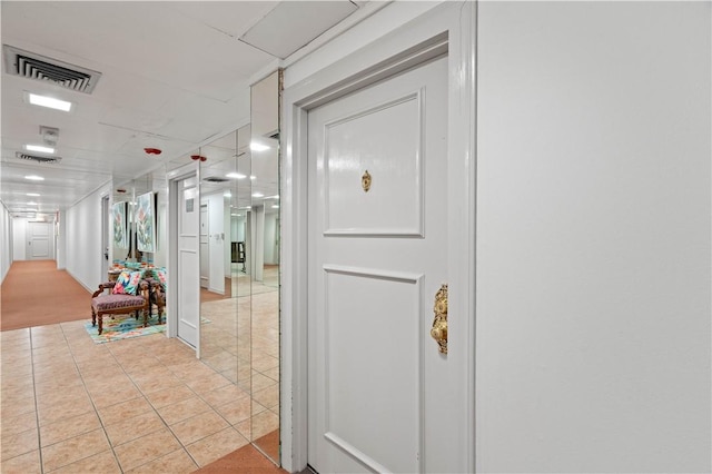 hallway featuring light tile patterned floors