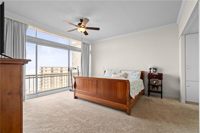 bedroom featuring access to exterior, ornamental molding, expansive windows, and carpet flooring