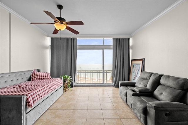 tiled living room with crown molding, ceiling fan, and expansive windows