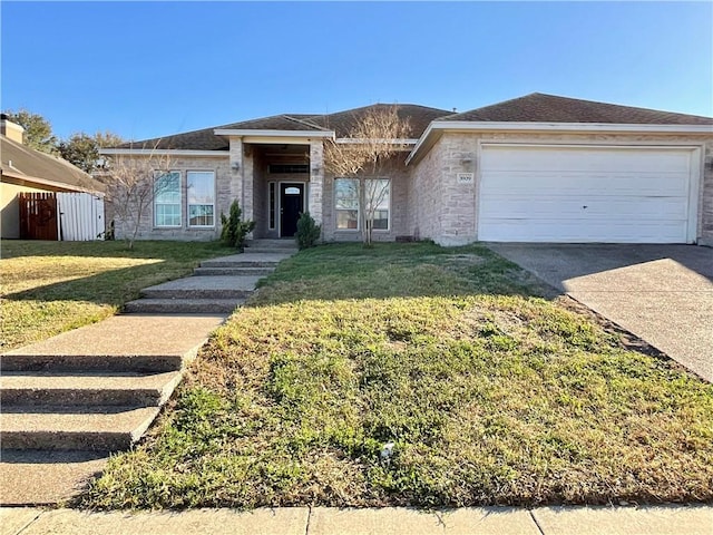 ranch-style house with a front lawn, a garage, and driveway