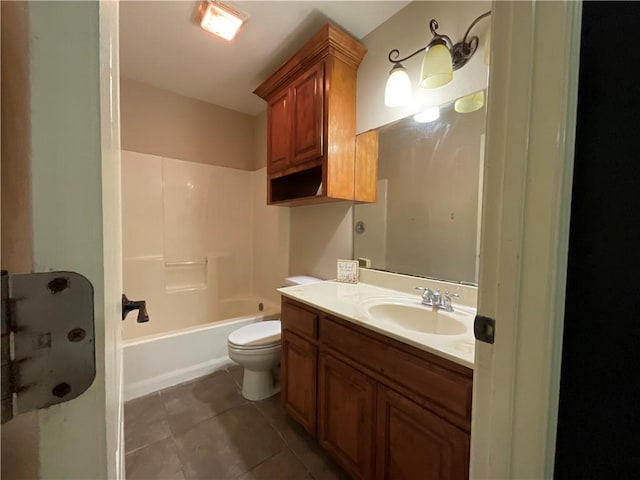 full bathroom featuring vanity, tile patterned floors, toilet, and bathtub / shower combination