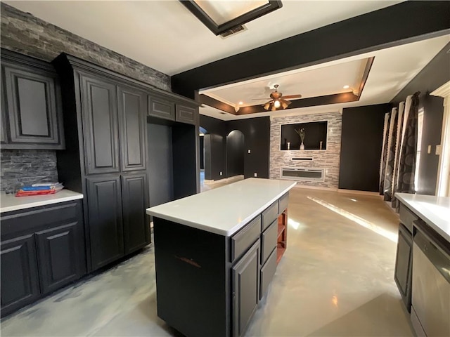 kitchen with visible vents, open floor plan, arched walkways, light countertops, and dishwasher