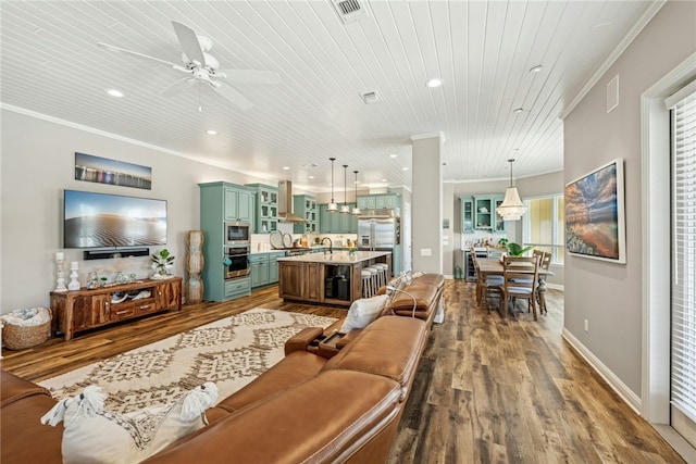 6 Sea Shell Shores Dr, Rockport, TX 78382 - living room with recessed lighting, dark wood finished floors, ornamental molding, wood ceiling, and ceiling fan