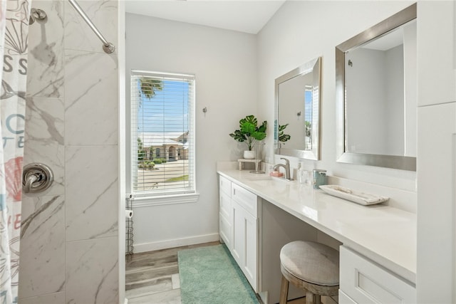 6 Sea Shell Shores Dr, Rockport, TX 78382 - full bath with baseboards, wood finished floors, vanity, and curtained shower