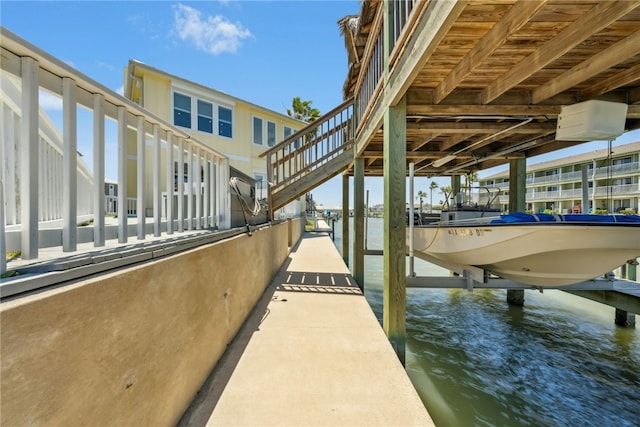 6 Sea Shell Shores Dr, Rockport, TX 78382 - dock area featuring a water view and boat lift