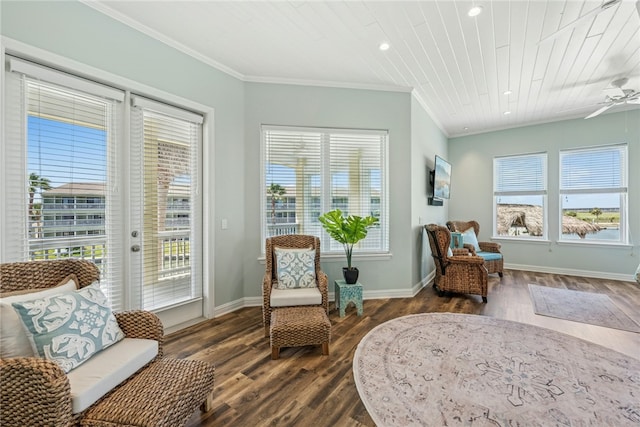 6 Sea Shell Shores Dr, Rockport, TX 78382 - living area with dark wood finished floors, ornamental molding, and a healthy amount of sunlight