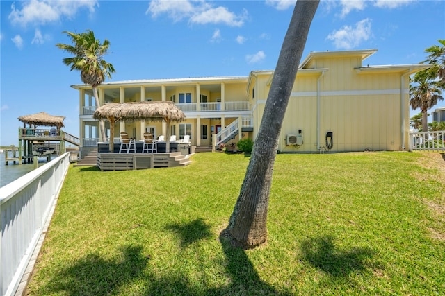 6 Sea Shell Shores Dr, Rockport, TX 78382 - back of house with fence, stairs, a yard, and a balcony