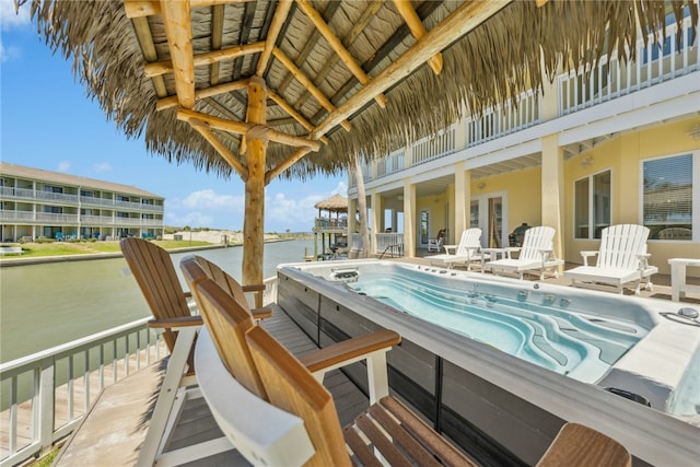 6 Sea Shell Shores Dr, Rockport, TX 78382 - view of swimming pool featuring an outdoor hot tub and a water view