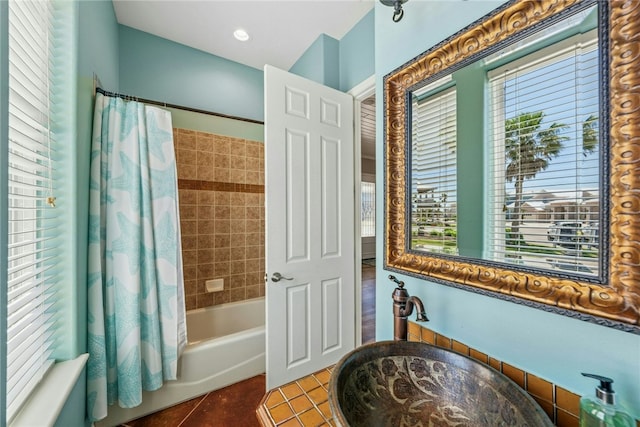 6 Sea Shell Shores Dr, Rockport, TX 78382 - bathroom with tile patterned flooring, a sink, and shower / bath combo with shower curtain