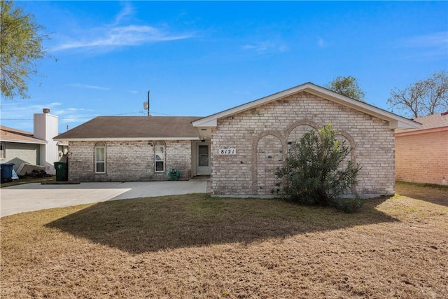 rear view of property with a lawn