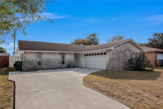 ranch-style house with a garage and a front yard