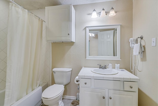 full bathroom featuring toilet, shower / tub combo with curtain, and vanity