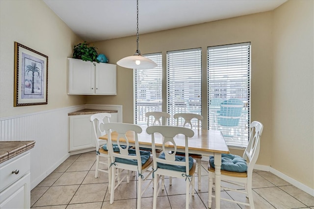 dining area with light tile patterned floors