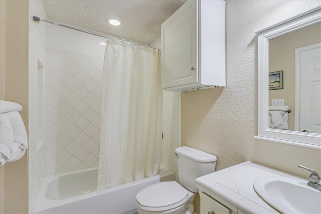 full bathroom with toilet, vanity, a textured ceiling, and shower / bath combo with shower curtain