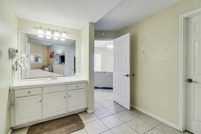 bathroom featuring tile patterned flooring, vanity, and ceiling fan