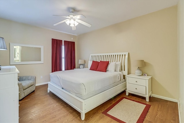 bedroom featuring hardwood / wood-style floors and ceiling fan