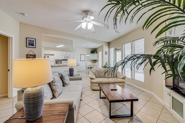 tiled living room with ceiling fan