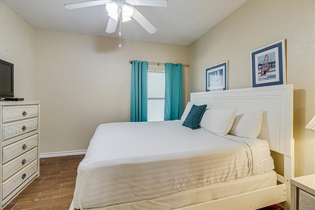 bedroom featuring ceiling fan and dark hardwood / wood-style floors