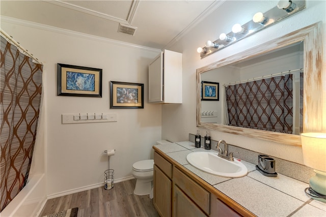 full bathroom featuring hardwood / wood-style flooring, ornamental molding, shower / bathtub combination with curtain, vanity, and toilet