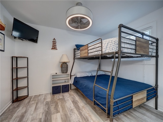 bedroom with hardwood / wood-style flooring