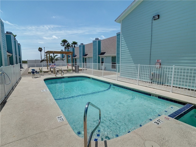 view of swimming pool with a patio