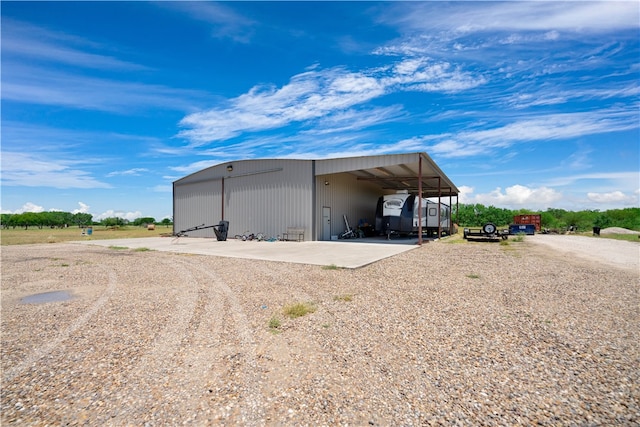 view of outdoor structure with a carport