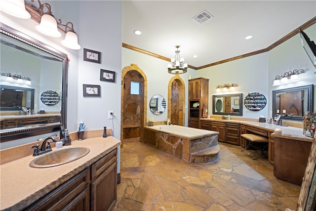 bathroom with a washtub, vanity, crown molding, and a notable chandelier