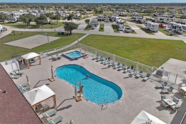 108 Augusta Cir, Aransas Pass, TX 78336 - community pool featuring a fenced backyard, a gazebo, a patio, and a hot tub