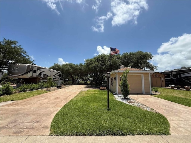 108 Augusta Cir, Aransas Pass, TX 78336 - view of front of property featuring concrete driveway, a front yard, and a garage