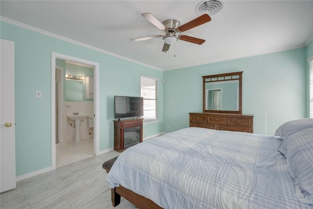 1038 Herndon St, Corpus Christi, TX 78411 - bedroom with crown molding, a ceiling fan, and connected bathroom