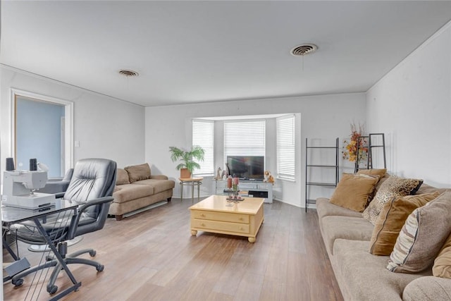 1038 Herndon St, Corpus Christi, TX 78411 - living room with wood finished floors and a desk