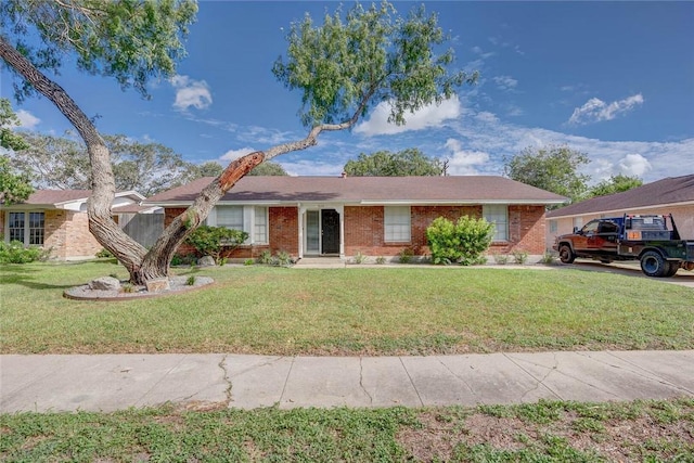 1038 Herndon St, Corpus Christi, TX 78411 - single story home featuring a front lawn and brick siding