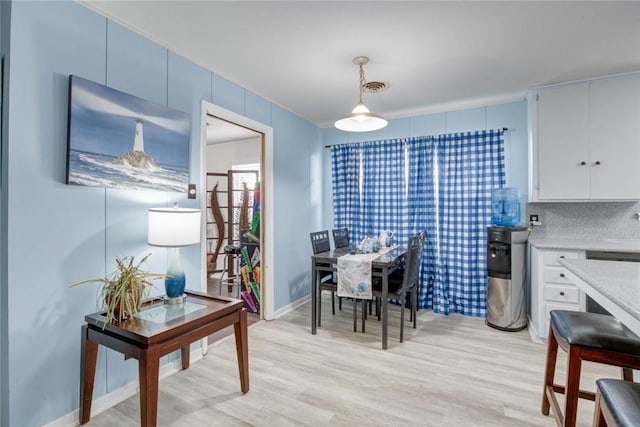 1038 Herndon St, Corpus Christi, TX 78411 - dining area with light wood-type flooring and baseboards
