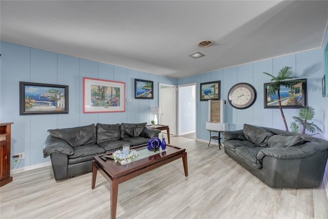 1038 Herndon St, Corpus Christi, TX 78411 - living area with light wood-style flooring and a decorative wall
