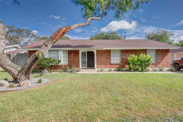 1038 Herndon St, Corpus Christi, TX 78411 - ranch-style house with brick siding and a front lawn