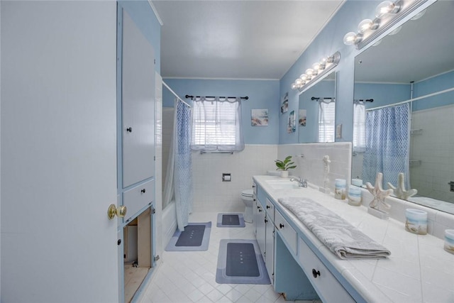 1038 Herndon St, Corpus Christi, TX 78411 - bathroom featuring vanity, shower / tub combo, tile walls, tile patterned flooring, and a wainscoted wall