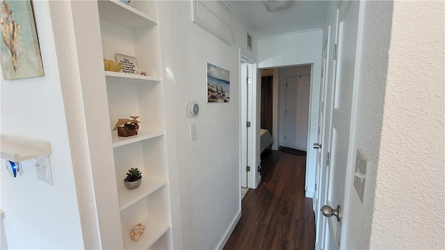 corridor featuring dark wood-type flooring