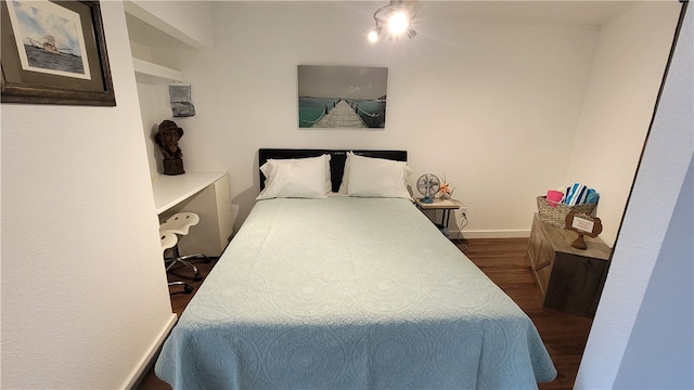 bedroom featuring dark hardwood / wood-style floors