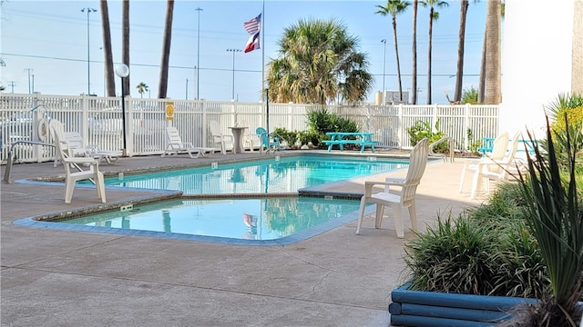 view of swimming pool featuring a patio