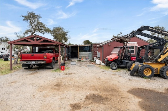 view of front of home featuring driveway and a carport
