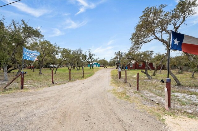 view of street featuring dirt driveway
