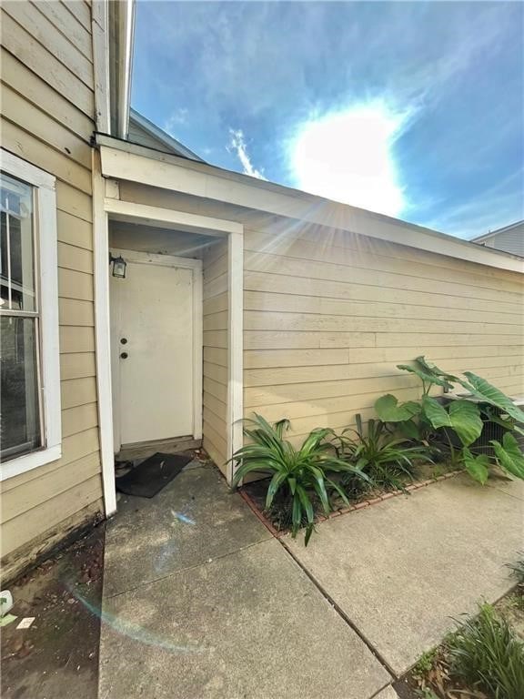 property entrance with a patio