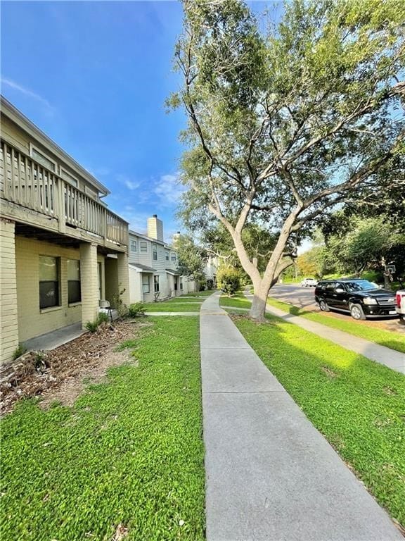 view of home's community featuring a yard