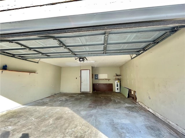 garage featuring a garage door opener and electric water heater