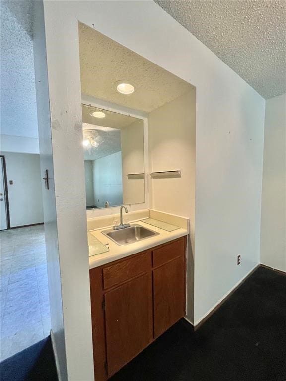 bathroom featuring vanity and a textured ceiling