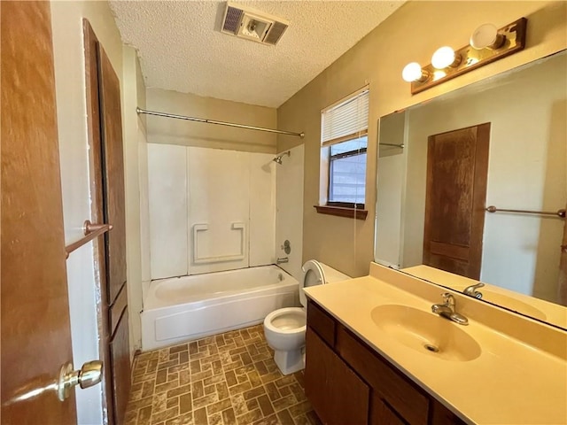 full bathroom with toilet, shower / bath combination, vanity, and a textured ceiling