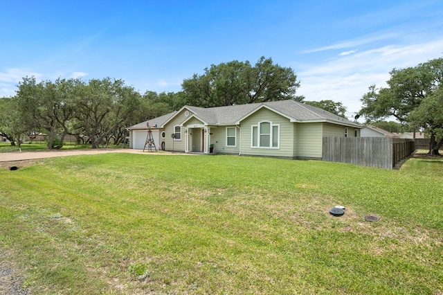 ranch-style home with fence, a front yard, driveway, and a garage
