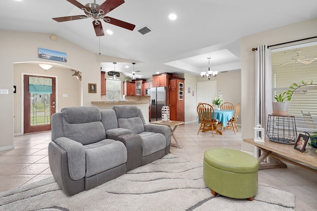 living room with baseboards, ceiling fan with notable chandelier, and visible vents